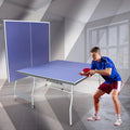 Rakon Blue Folding Rolling 8×4 FT Table Tennis Table Indoor and Outdoor Table Tennis Table, 2 Rackets, 3 Balls, 1 Net and 4 Wheels Set Behind It for Easy Movement