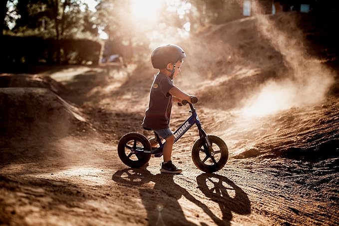 Strider 12” Sport Bike - No Pedal Balance Bicycle for Kids 1 to 4 Years - Includes Safety Pad, Padded Seat, Mini Grips & Flat-Free Tires - Tool-Free Assembly & Adjustments